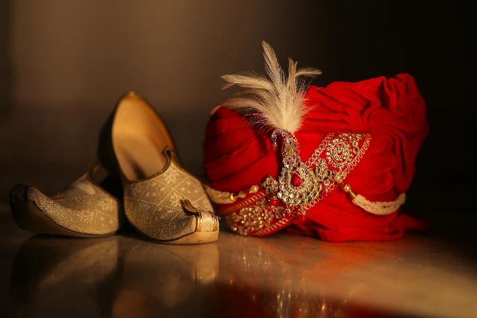 Ornate red turban and gold shoes